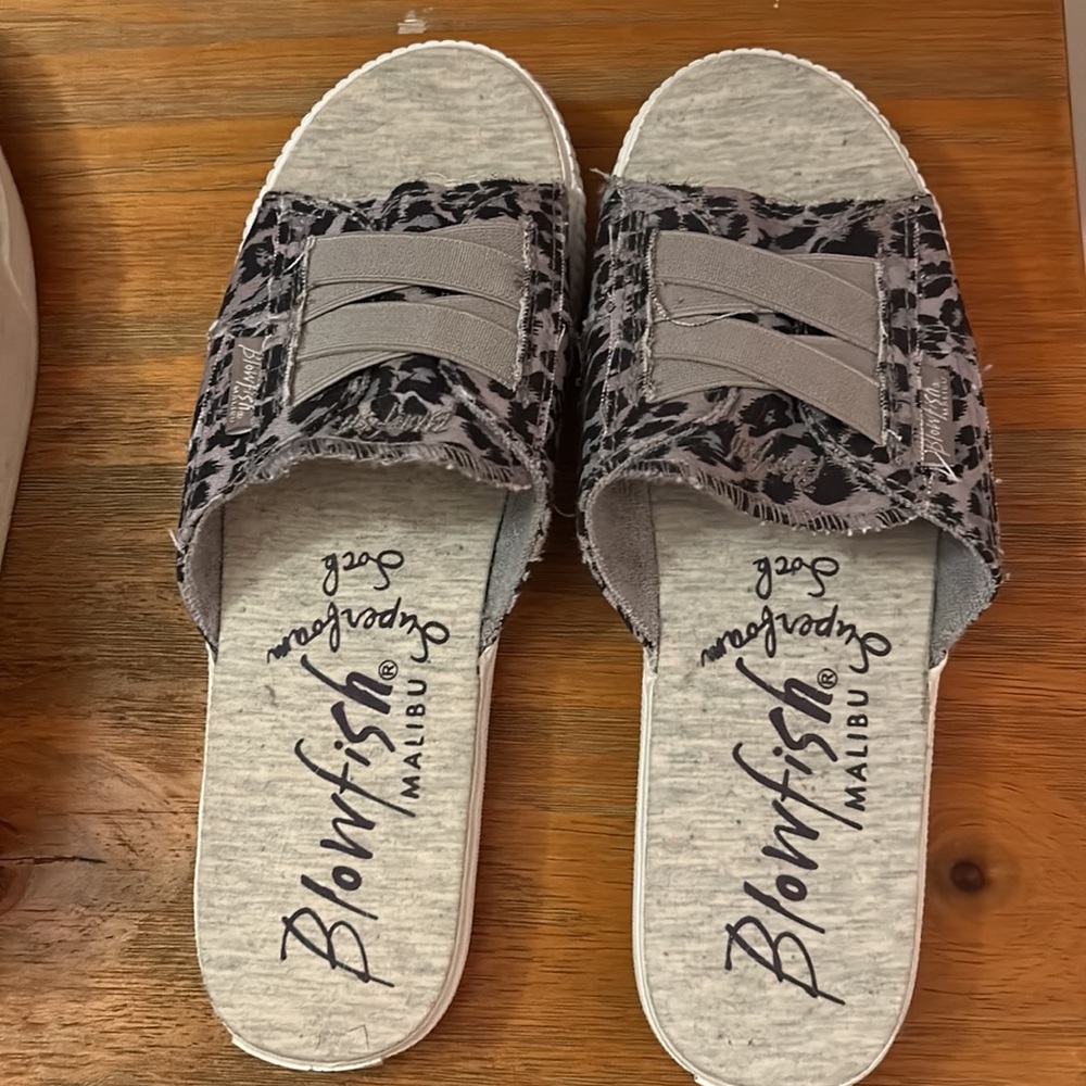 Blowfish purple and gray sandals never wore outside so they’re like new.